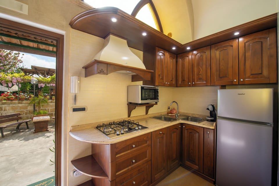 Luxury Apartment, Multiple Beds, Garden View | Private kitchen | Coffee/tea maker