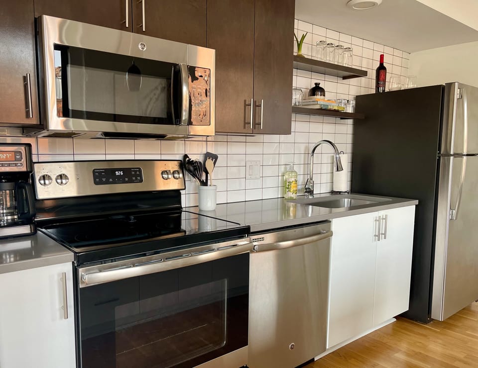 Full kitchen with stainless steel appliances