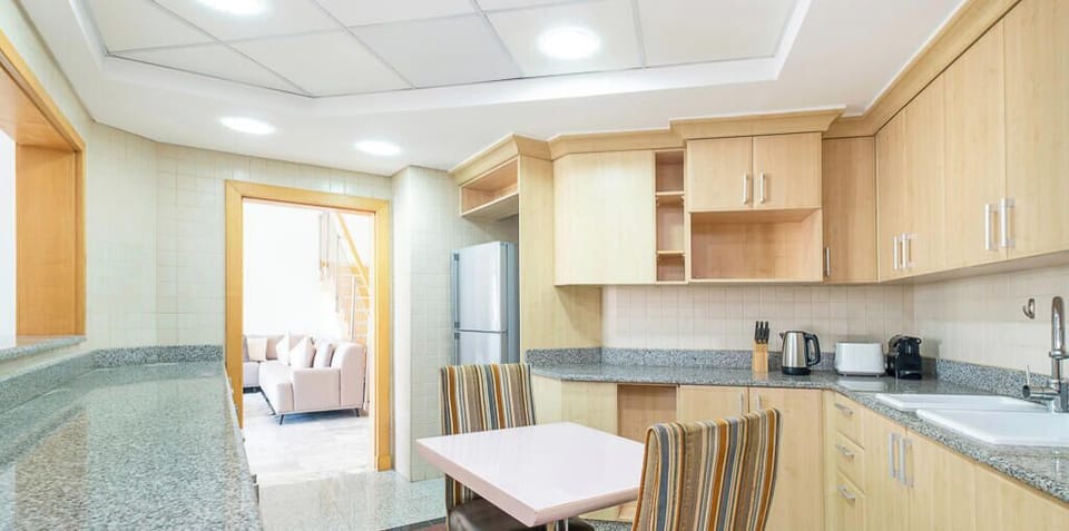 Penthouse, Balcony, Partial Sea View | Private kitchen | Electric kettle, toaster
