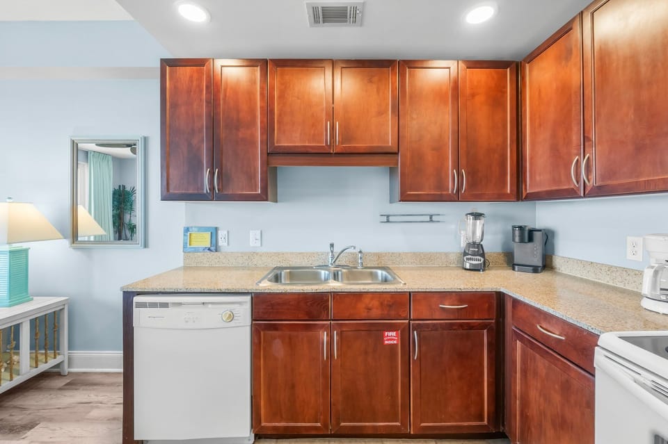 kitchen with dark wood cabinets and modern appliances