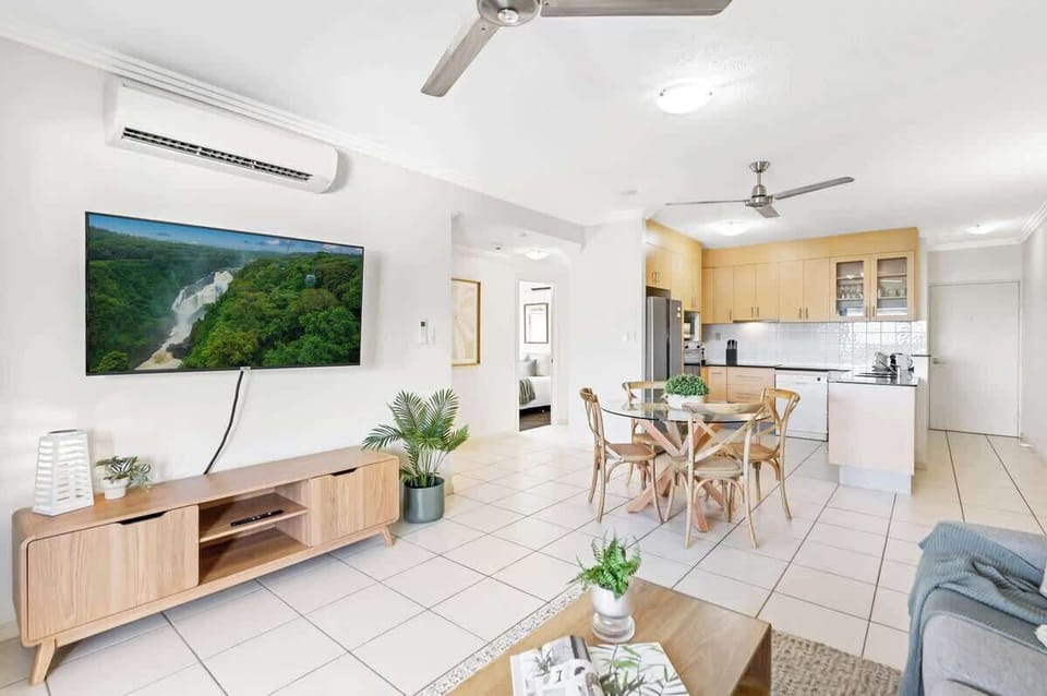  The living and dining area is open plan with a dining table to come together for a shared meal.
