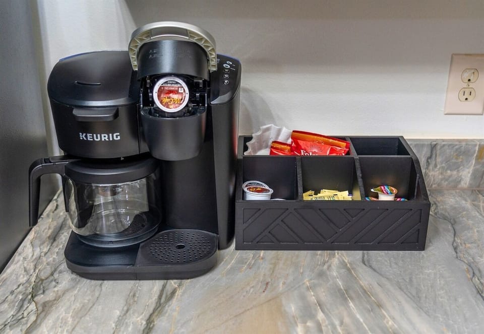 Start your mornings right with a coffee station featuring a Keurig and everything you need for the perfect brew—because a good day starts with great coffee.