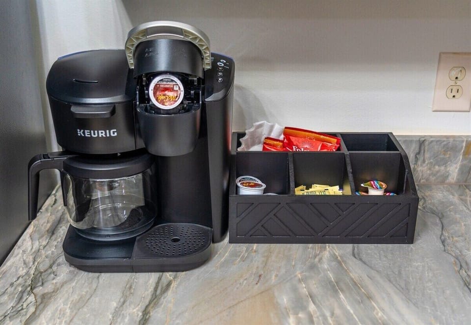 Start your mornings right with a coffee station featuring a Keurig and everything you need for the perfect brew—because a good day starts with great coffee.