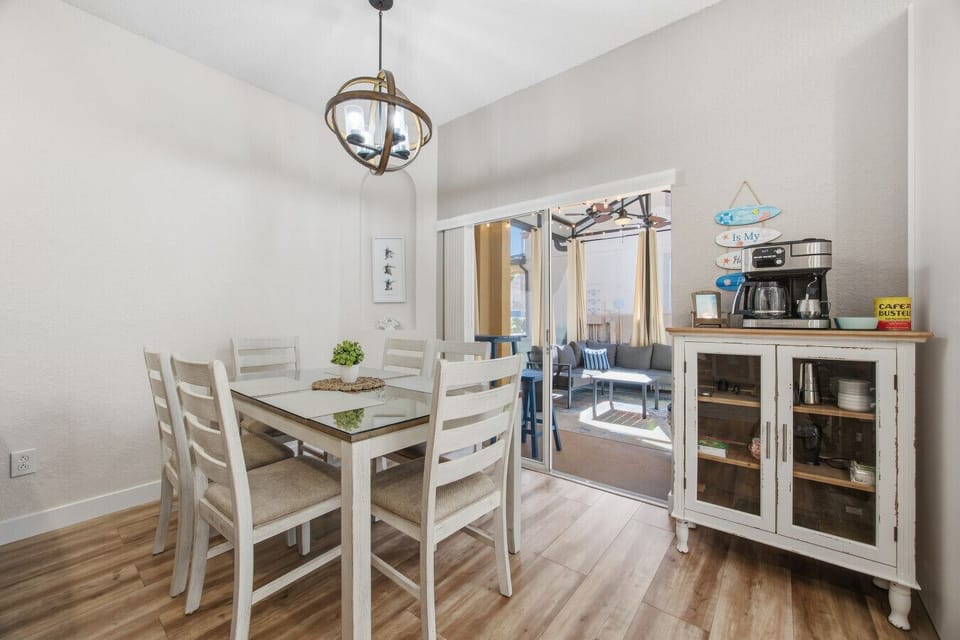 Charming dining area with access to a sunny patio and coffee station.