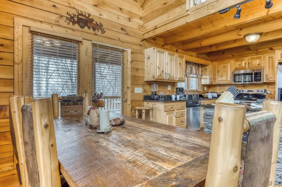 Dining area off the kitchen comfortably sits 7 guests with more seating outside as well.