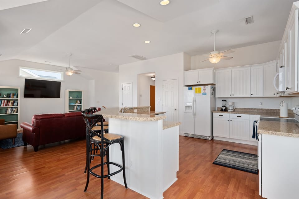 Plentiful seating in the kitchen area with three stools at the breakfast bar!