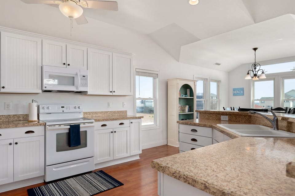 This modern and new kitchen is fully stocked with everything you could ever need when cooking for your entire family!