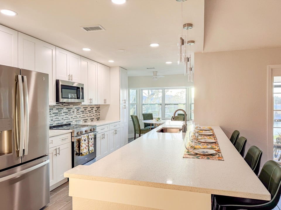 Bright, open, fully-equipped kitchen. Kitchen table seats 4 with the kitchen island seating an additional 4
