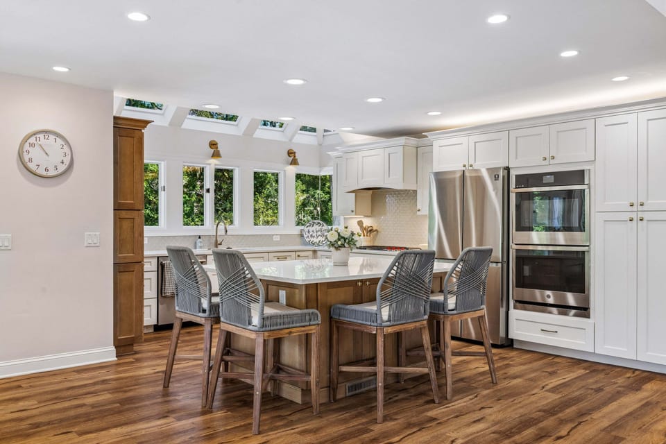 At the heart of this space is the chef's kitchen, featuring top-of-the-line appliances, including a gas range and double oven, making it fully equipped for everything from quick breakfasts to elaborate holiday feasts.