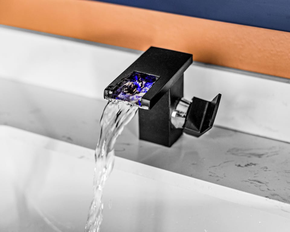 Waterfall faucets light up and change color based on water temperature.