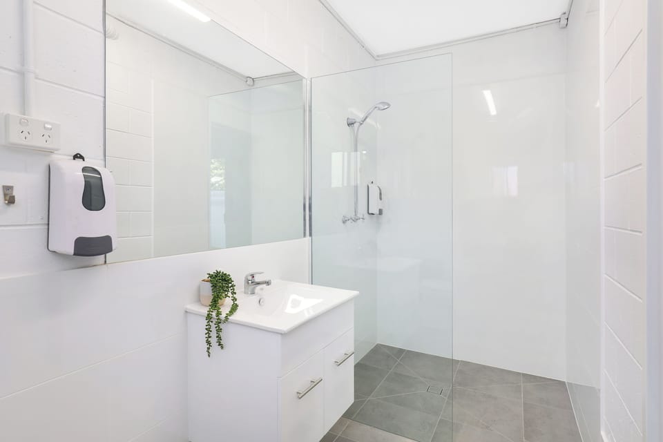 Shower, towels, soap, toilet paper