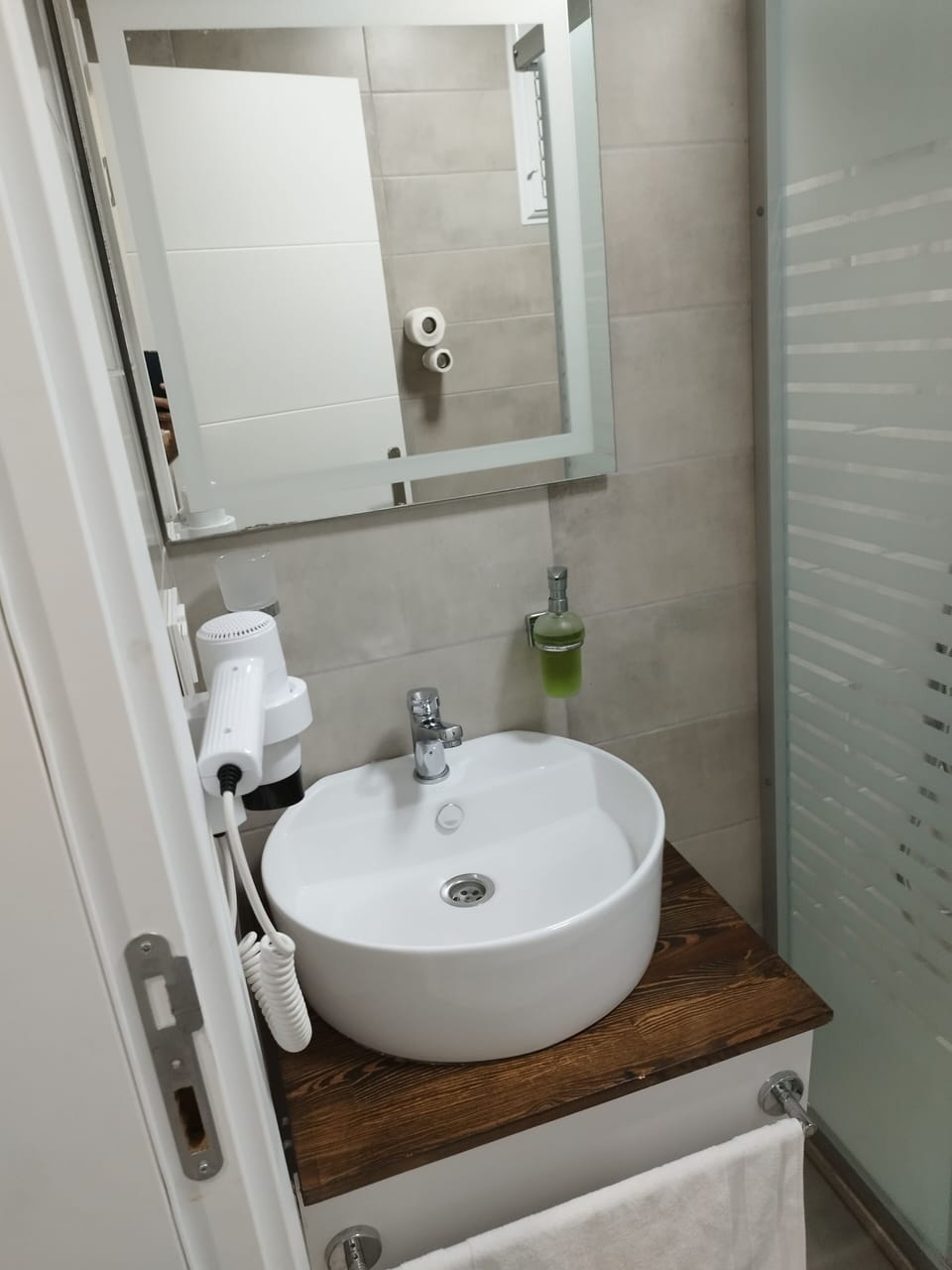 Shower, hair dryer, slippers, towels