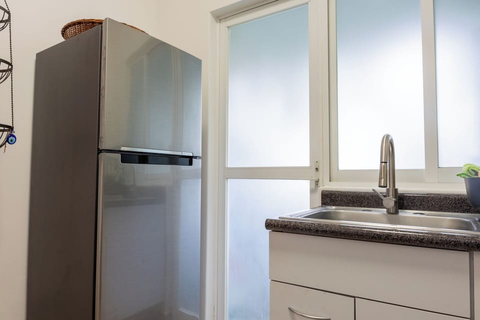 Deluxe Apartment, City View | Private kitchen | Electric kettle