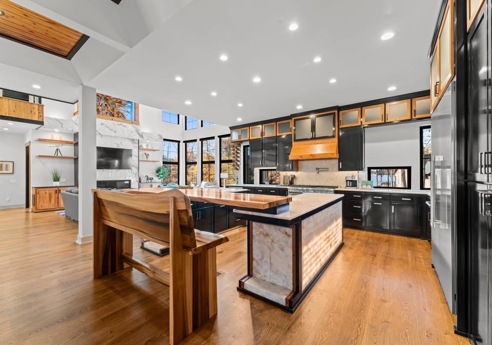 Huge, modern, fully stocked kitchen with two island seating options seating 8+. 