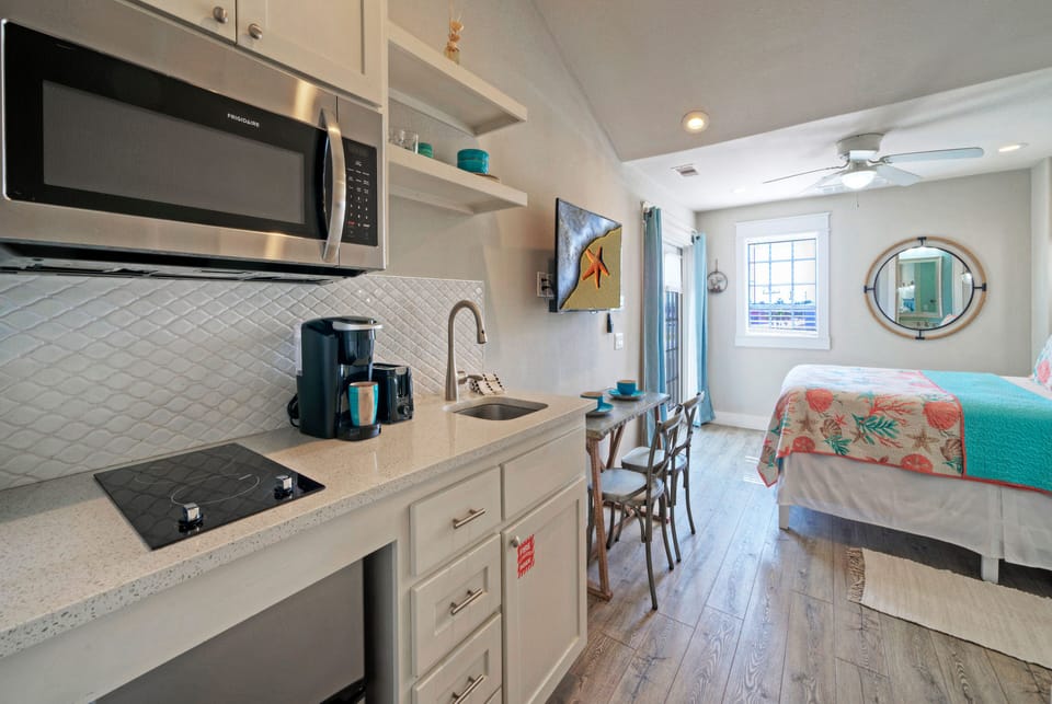 Kitchenette with a microwave and two-burner stove. (Sailfish)