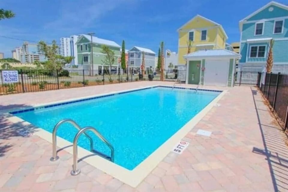 Serene poolside retreat with ample lounge space and sunny surroundings