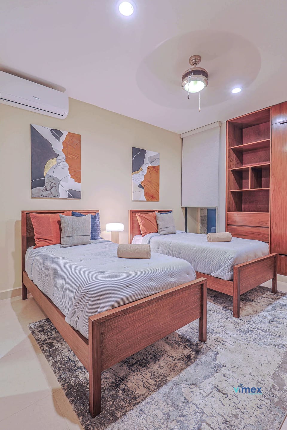 Bedroom with two single beds and decor.