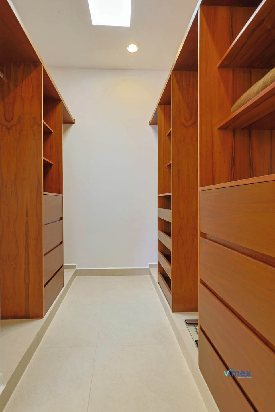 Spacious walk-in closet with ample shelving and natural light, perfect for organizing your belongings.
