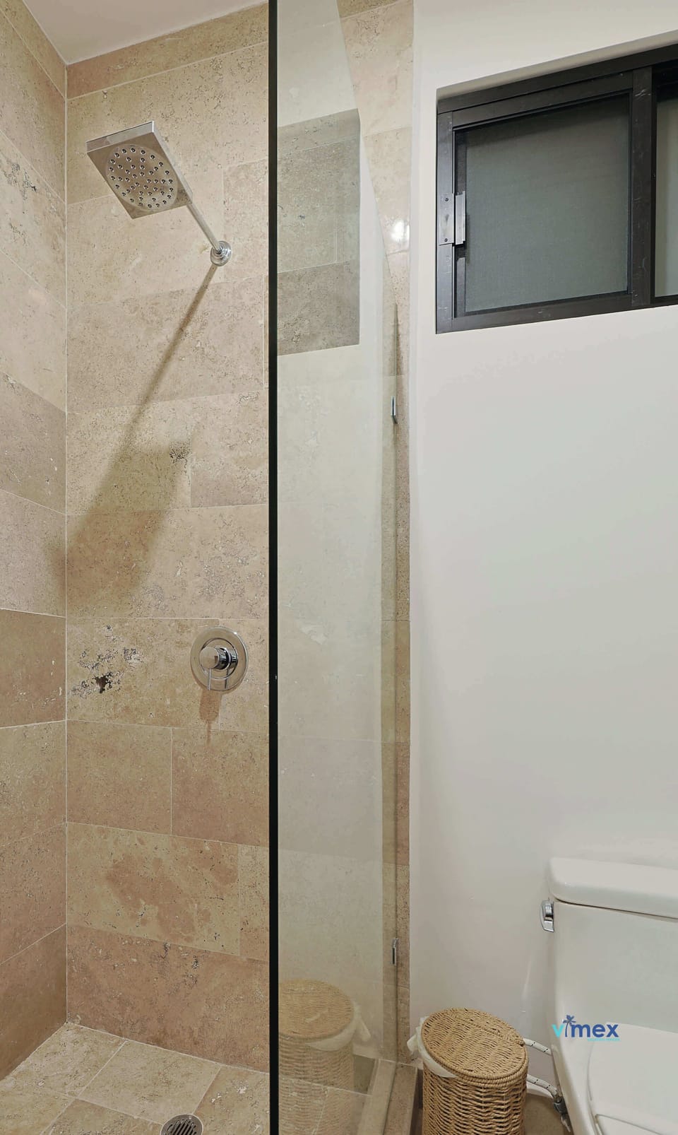 Walk-in shower with high-end fixtures.