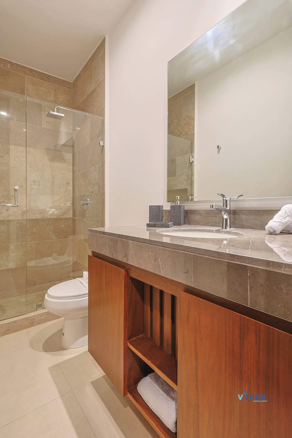 Bathroom with elegant tiling and shower.
