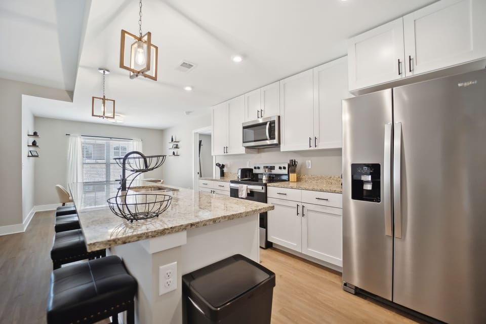 Gather at the kitchen island and wait for the cookies you are baking in the oven. 