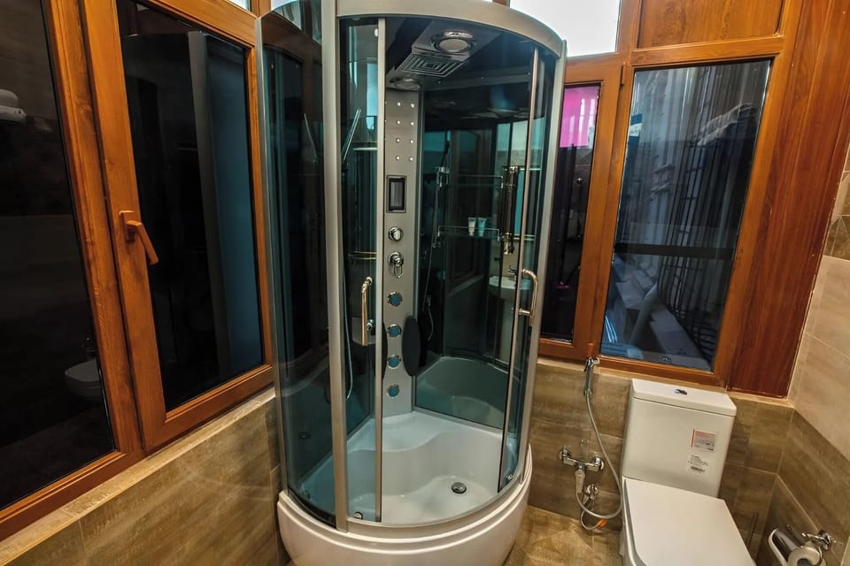 Deluxe Double Room, City View | Bathroom | Shower, hydromassage showerhead, hair dryer, slippers