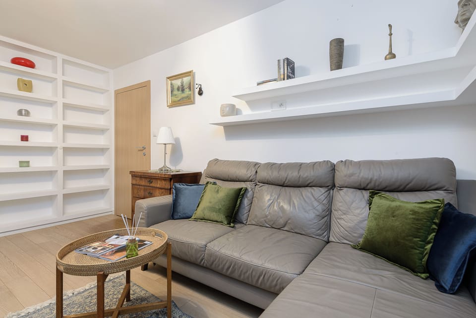 Deluxe Apartment, Balcony, Courtyard View | Living area | 40-inch TV with digital channels