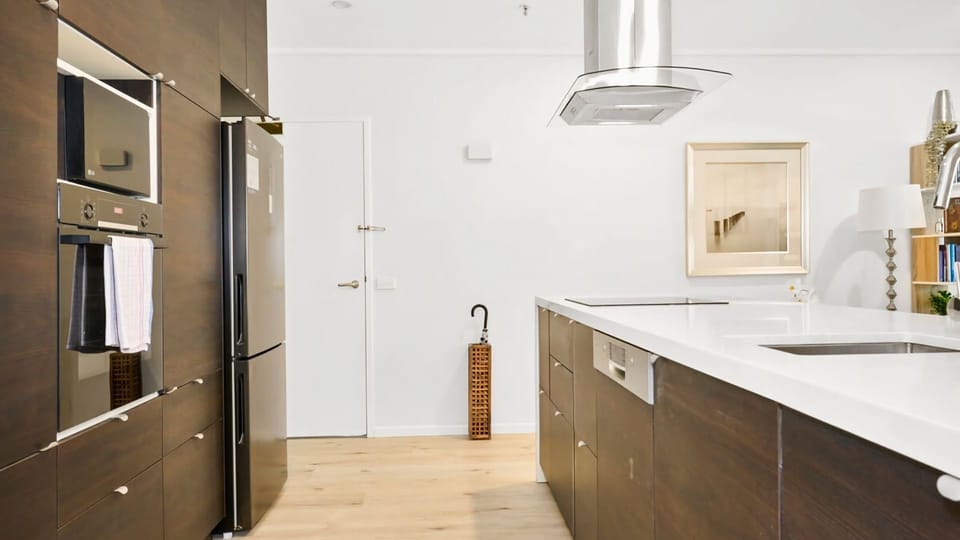 Sleek, modern kitchen equipped with high-end appliances.
