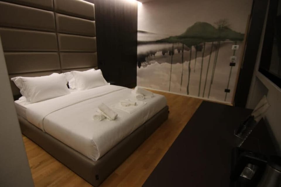 Standard Double Room, City View | Desk, laptop workspace, soundproofing, iron/ironing board