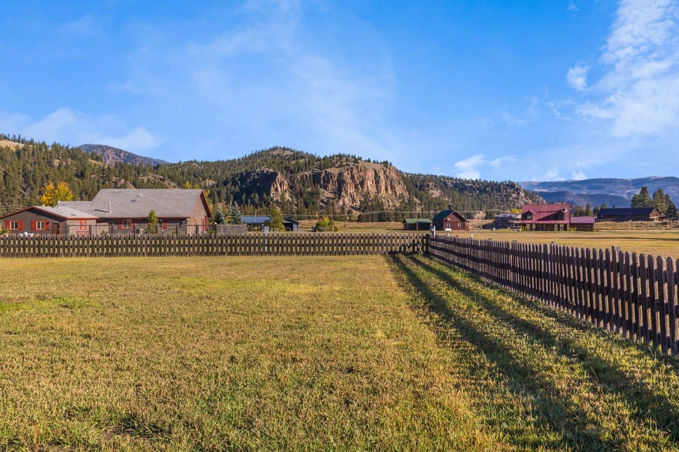 Back yard - Enjoy views of the mountains from our large, fenced backyard.