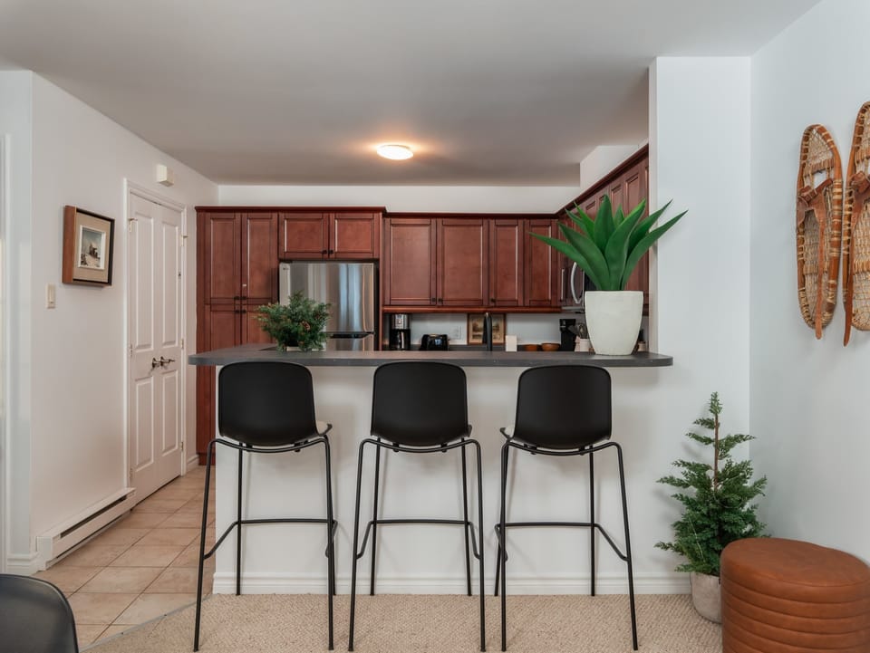 A kitchen island that invites casual breakfasts and evening drinks