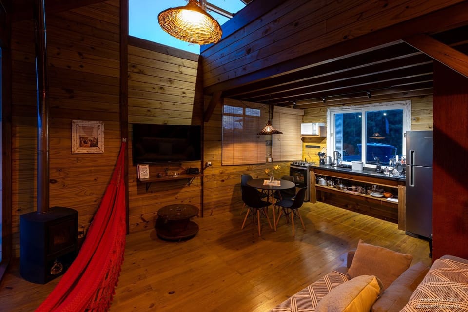 Honeymoon Cabin, Hot Tub, Lagoon View | Living area | 50-inch Smart TV with digital channels, fireplace, Netflix