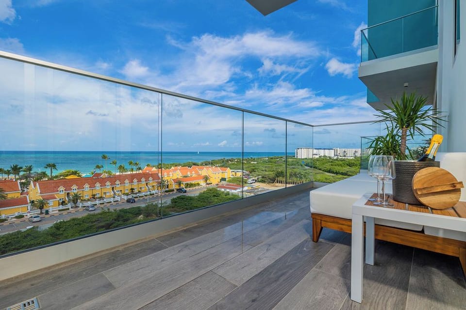 This spacious balcony offers stunning panoramic views of turquoise waters and tropical surroundings, perfect for your morning coffee or sunset cocktails. Unwind in your private outdoor retreat.