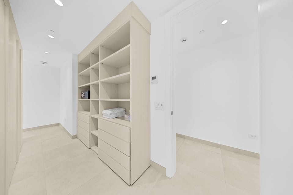 Ample storage space keeps your belongings organized and out of sight, with custom shelving and drawers designed to maximize your comfort and convenience throughout your stay.