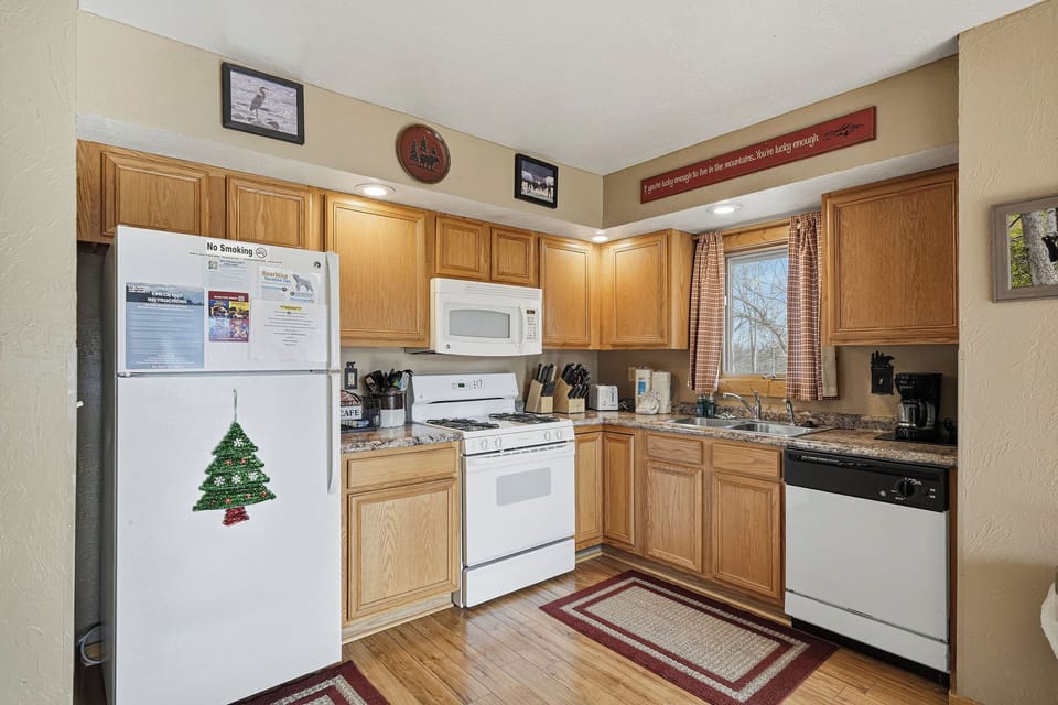 Your fully equipped kitchen awaits with granite counters, oak cabinets, and all appliances needed for home-cooked meals during your stay.
