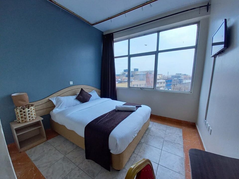 Deluxe Double Room, City View | Desk, laptop workspace, iron/ironing board, free WiFi