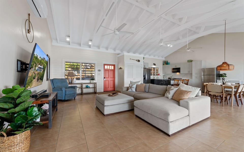 Open Living Room with Ocean Views Bright living room with panoramic Caribbean water views and cool coastal breezes.
