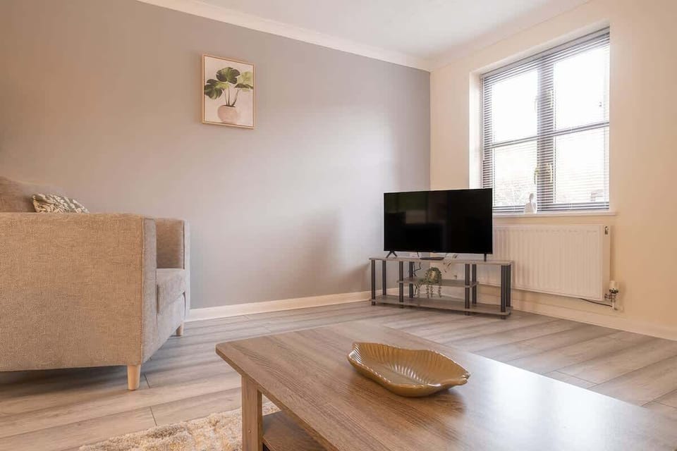 Settle into the comfy sofa and armchair for a perfect evening of relaxation in front of the large TV