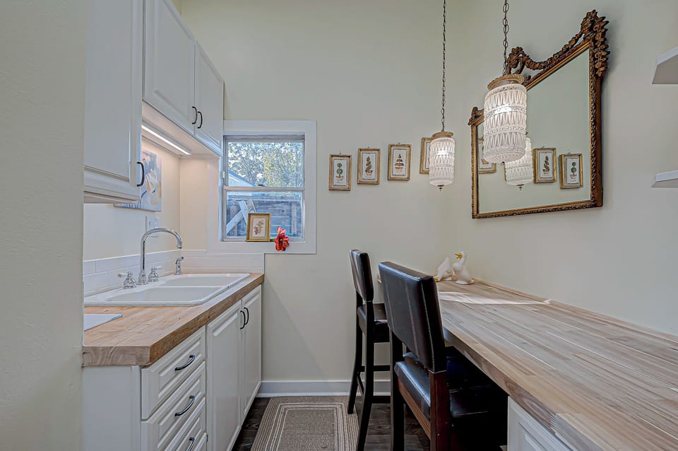 Kitchen sink and bar area with butcher block countertops!