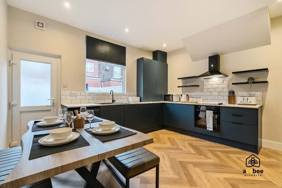 Gather around the dining table or cook together in this inviting open-plan area—your home away from home.