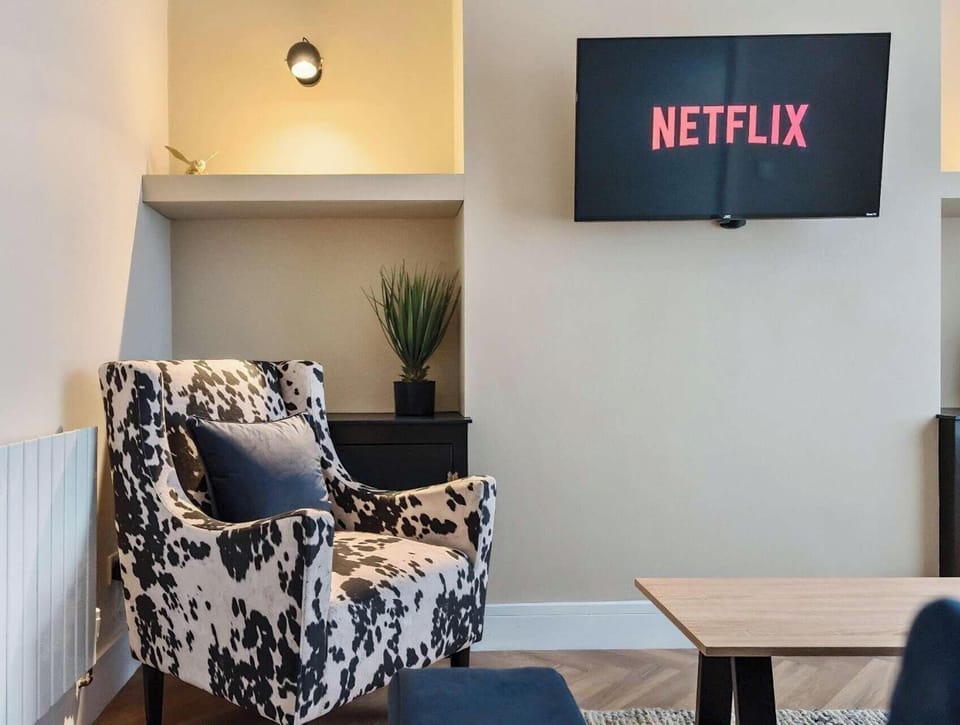 Relax in style with a cozy living area and a smart TV ready for your favorite shows and movies.
