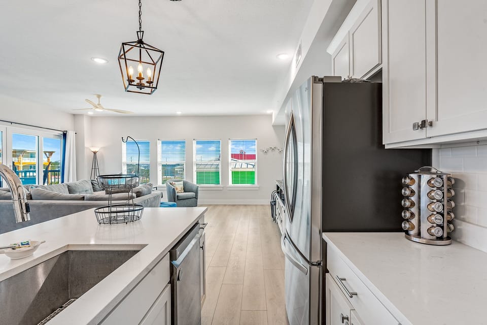 Stocked kitchen with granite counter tops and stainless steel appliances