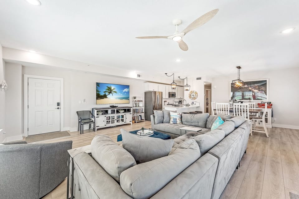 Spacious Living Room with 75" smart TV, and secure high speed WiFi access