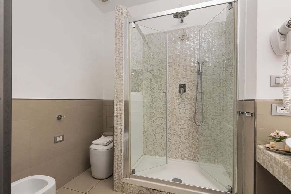 Deluxe Double Room, City View | Bathroom | Shower, hair dryer, bidet, towels