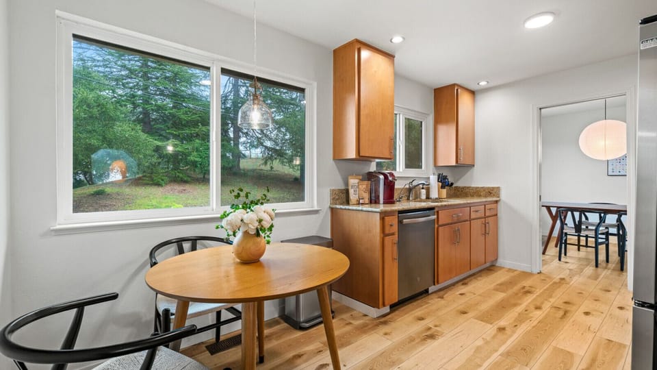 Dining area in kitchen offers a perfect indoor eating space with beautiful views,