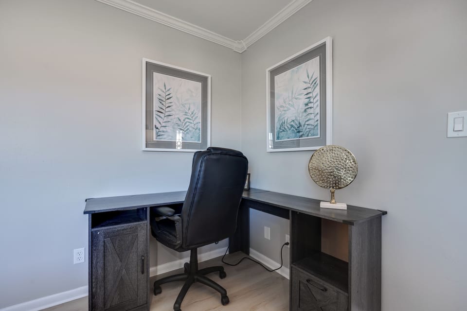 A dedicated work space with a comfortable setup, perfect for remote work or studying.
