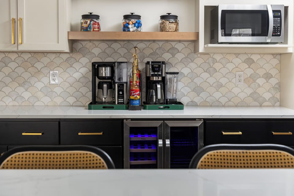 "Dual coffee station in the kitchen with syrups and all the fixings for your perfect brew!"