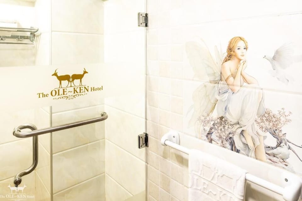 Shower, hair dryer, slippers, towels