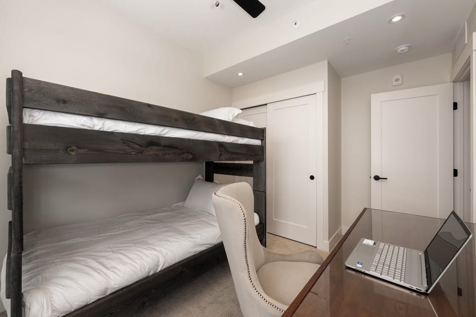 Kids’ bunk room, twin bunk bed, 32” Roku Smart TV, and workstation