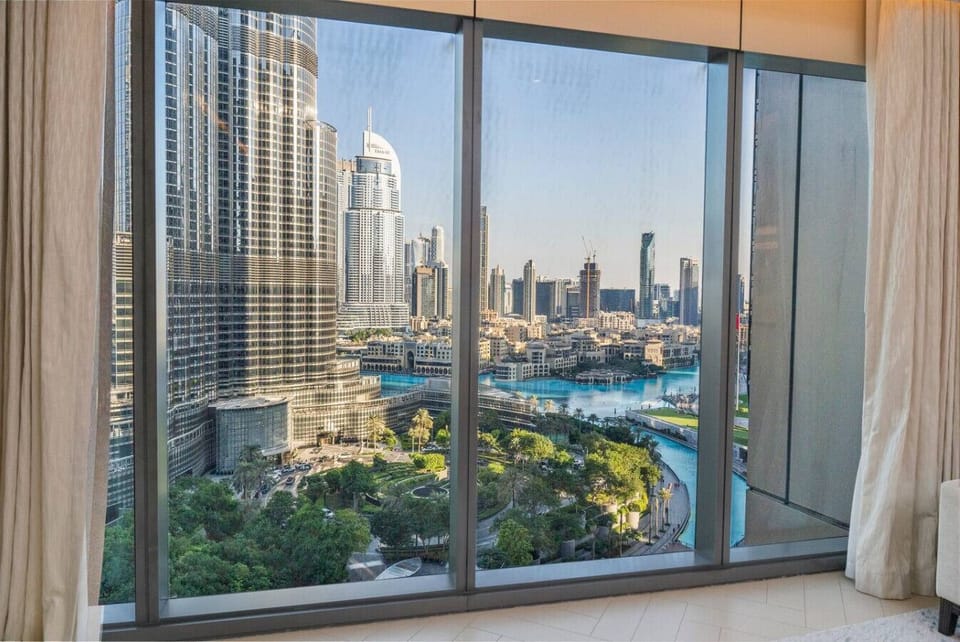 Living Room: Unwind with stunning skyline views and modern elegance – your Dubai adventure awaits!